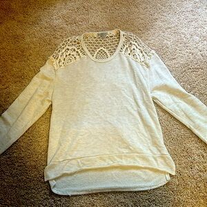 A Charlotte Russe long sleeve with back out.